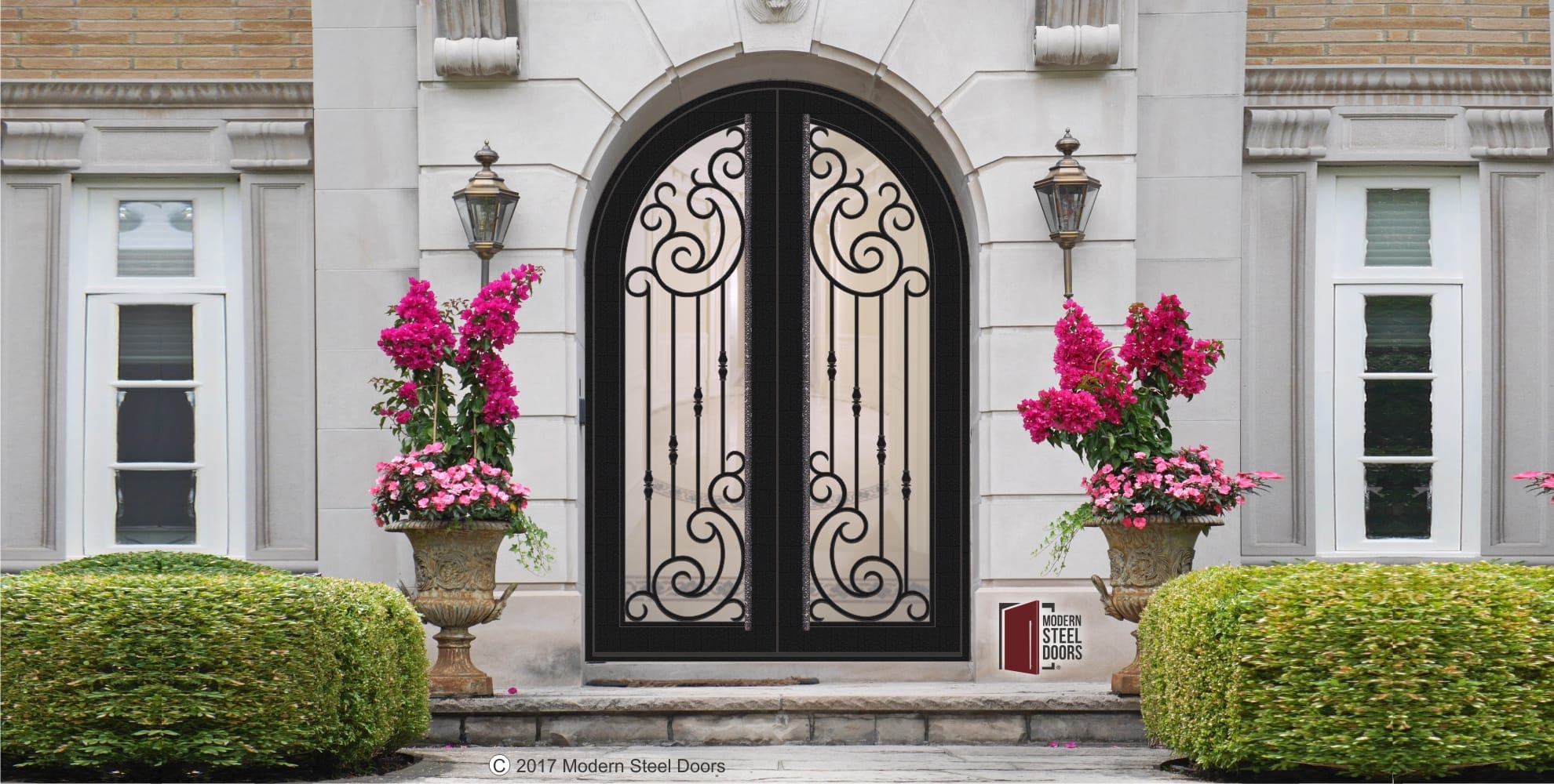 arched transitional double door with scroll design with round custom door hardware on home exterior